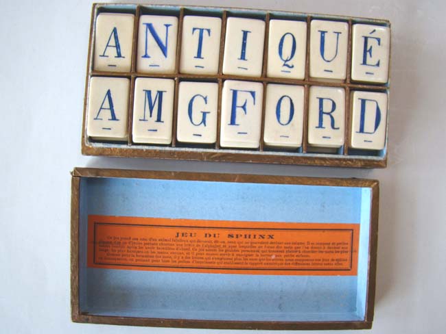A Boxed Set of Antique Ivory Alphabet Tiles made in France circa 1850-1875